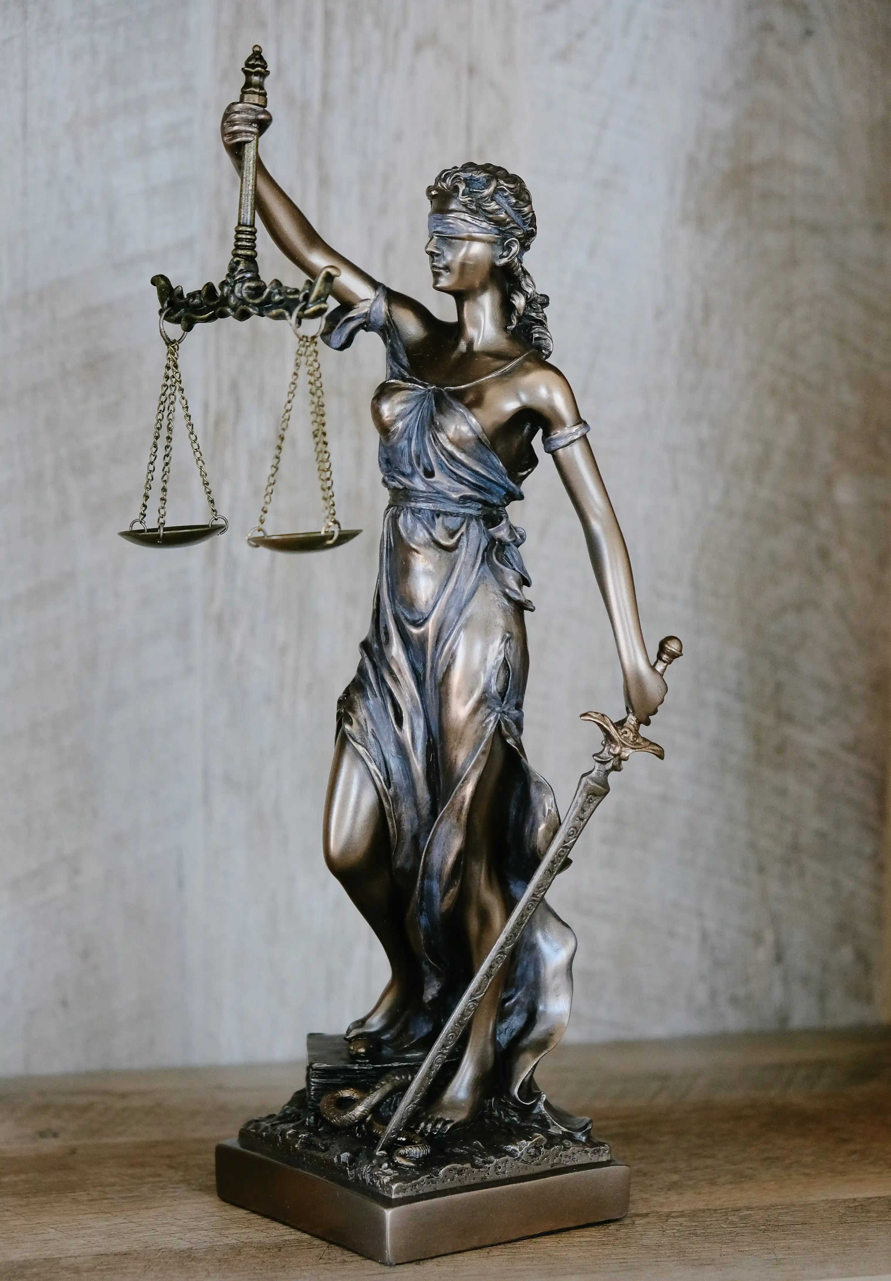 Statue of Woman Holding Scales of Justice